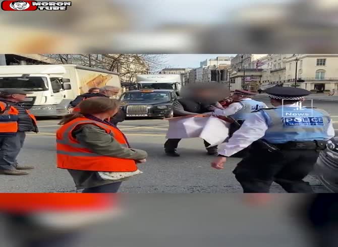 Video :The cops stop him when he tries to get past a barricade of environmental demonstrators